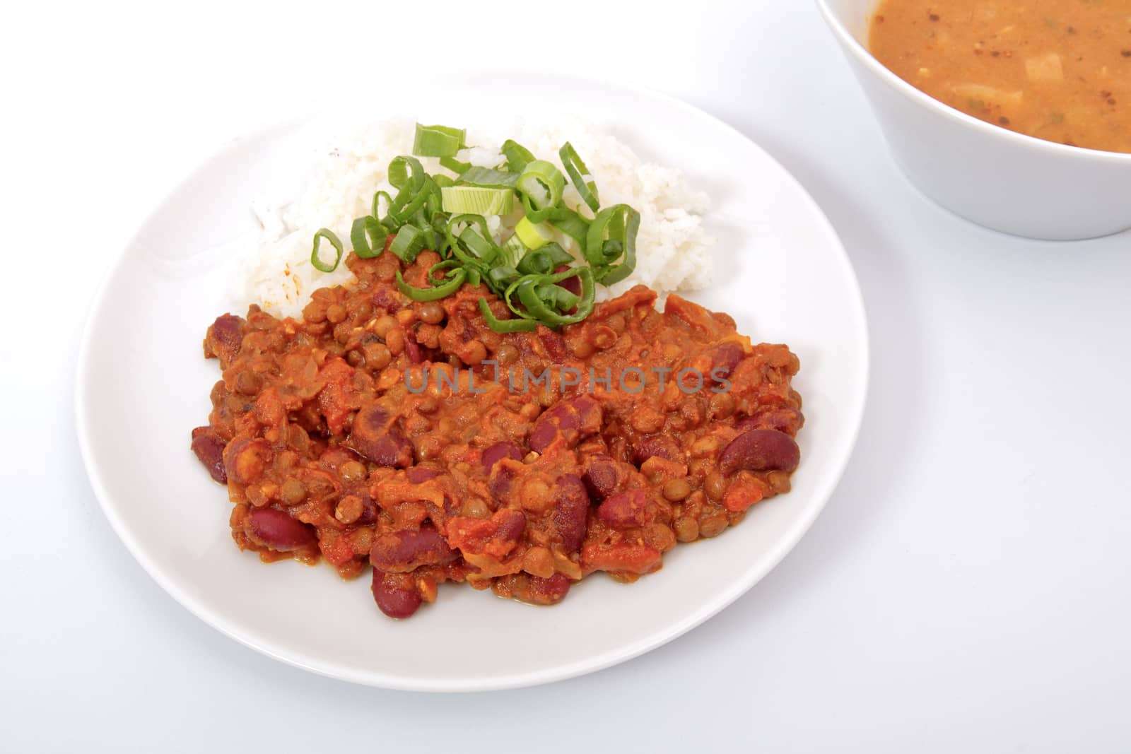 Indian legume hash with rice on a white background