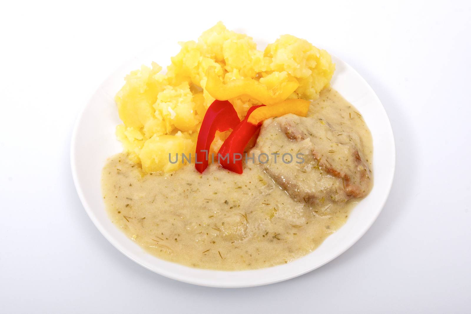 Seitan with dill sauce and potatoes on a white background