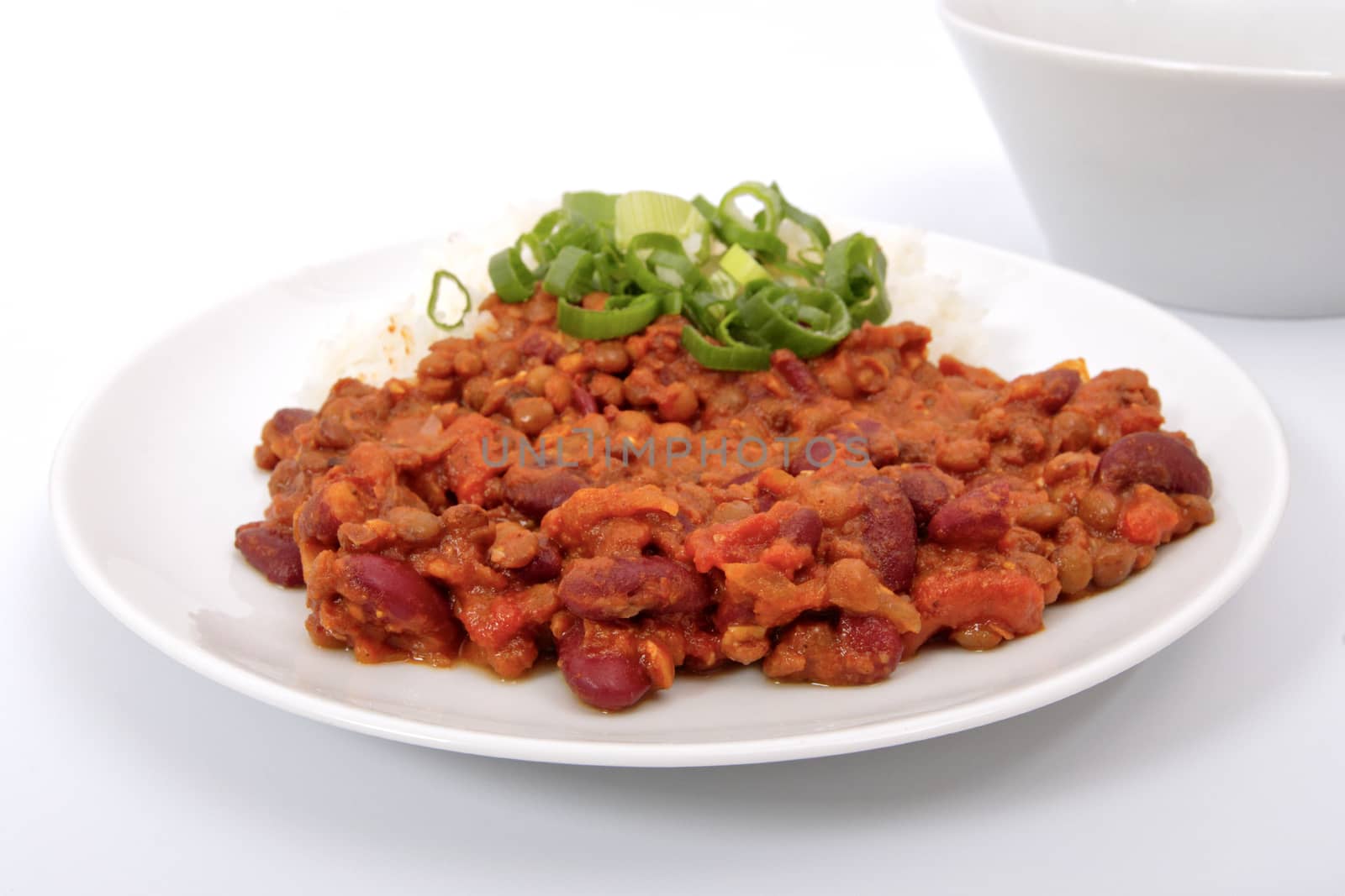 Indian legume hash with rice on a white background