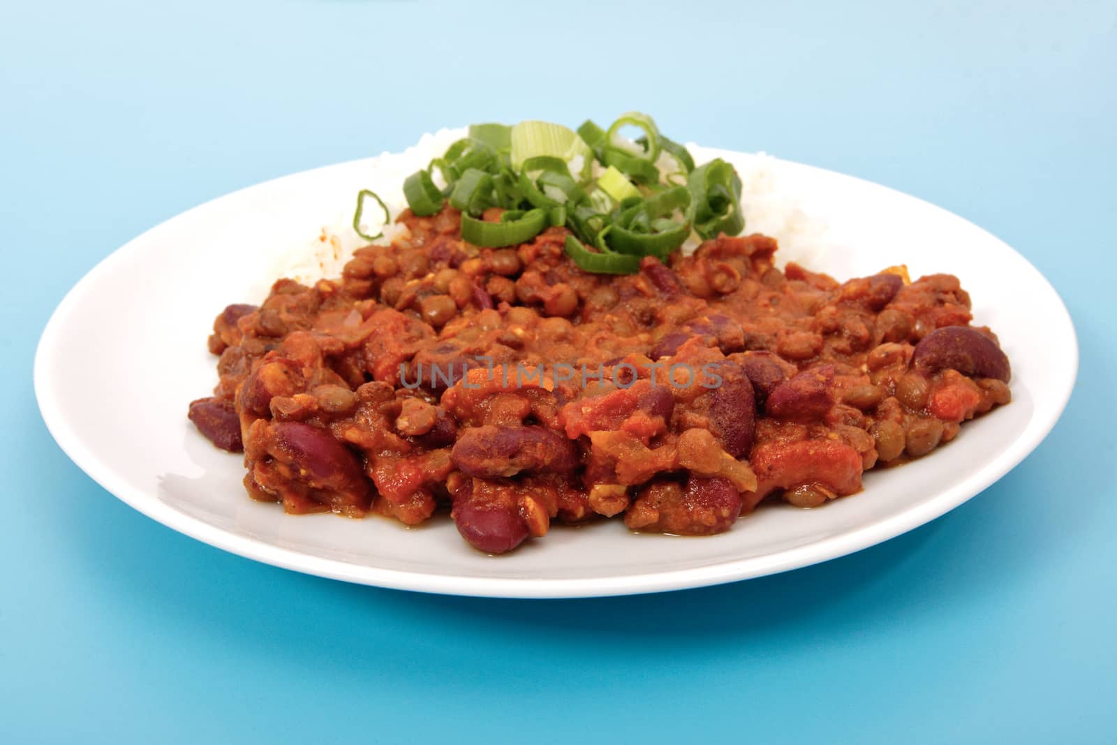 Indian legume hash with rice on a blue background