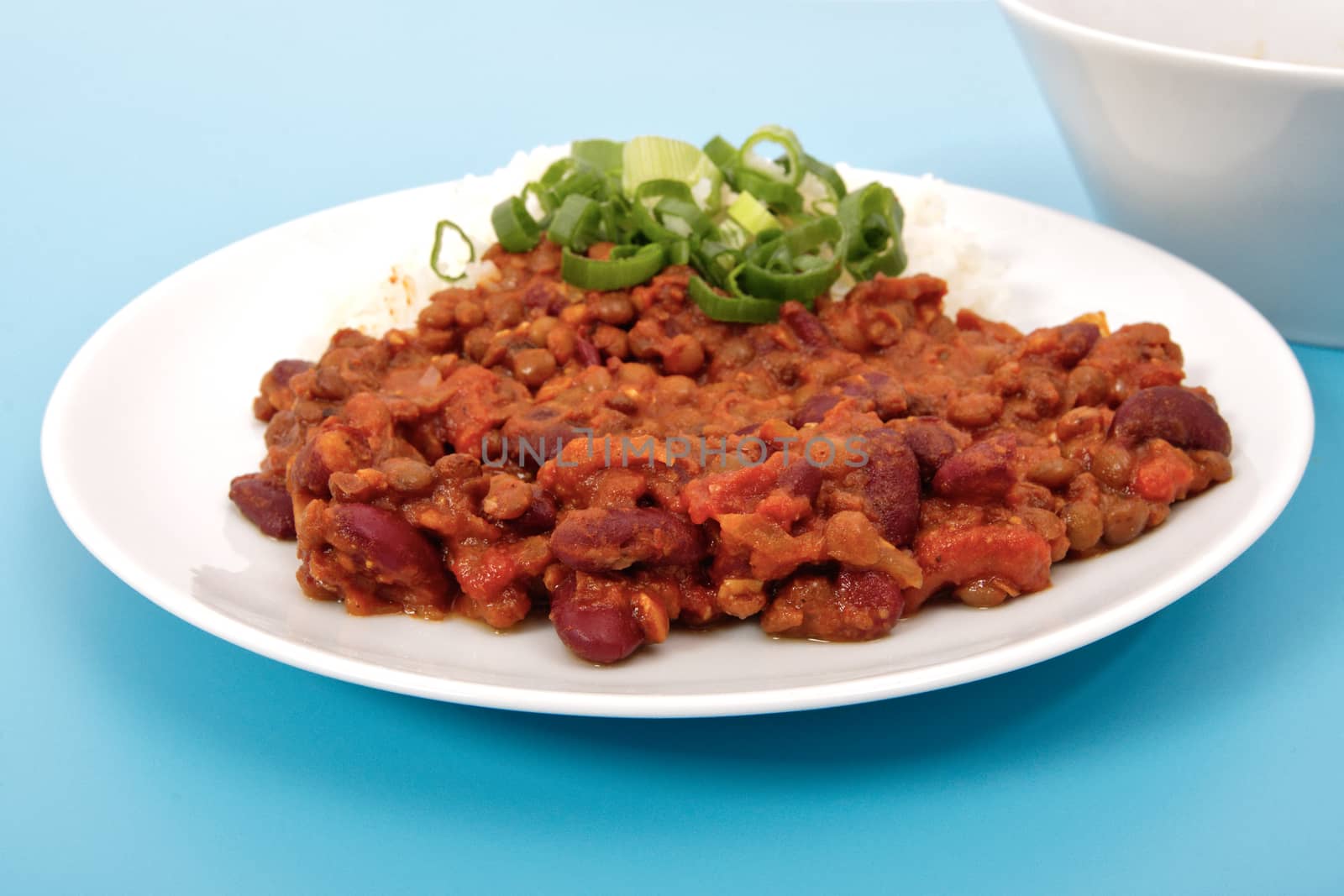 Indian legume hash with rice on a blue background