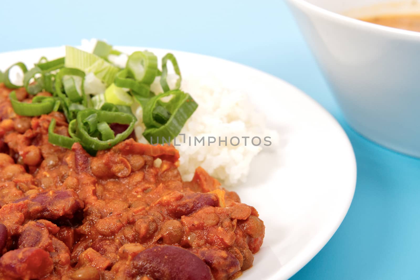 Indian legume hash with rice on a blue background