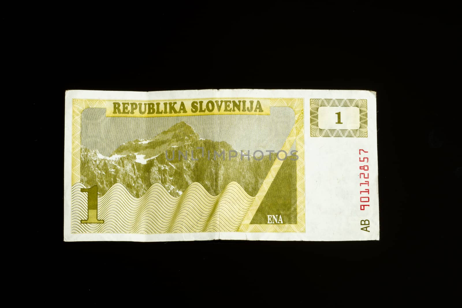One 1 tolar bill of Slovenia, first paper bank note introduced after declaring independance, isolated on black