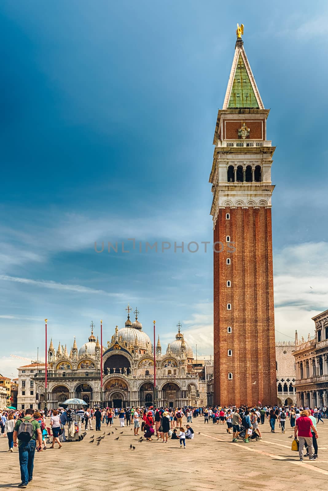 Tourists visiting the iconic St. Mark's Square in Venice, Italy by marcorubino