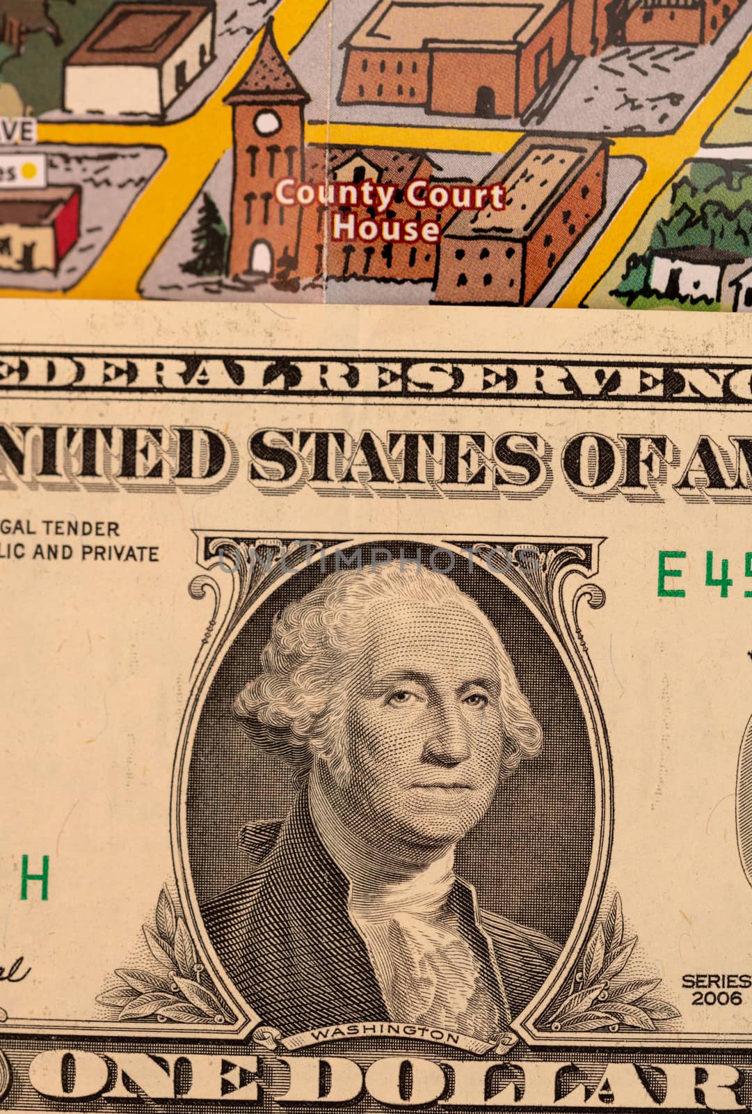 Detail of travel map Flagstaff, Arizona, USA with one Dollar bill just below the couthouse, justice and travel concept by asafaric