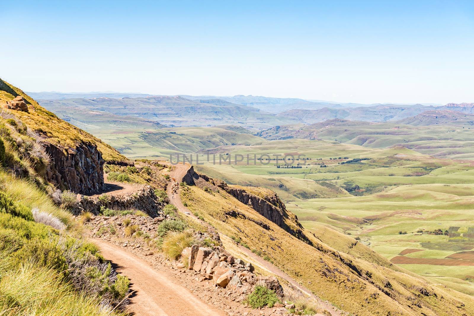 An aerial view of the Naudes Nek Pass in the Eastern Cape Province of South Africa. Cattle, a person and a vehicle are visible