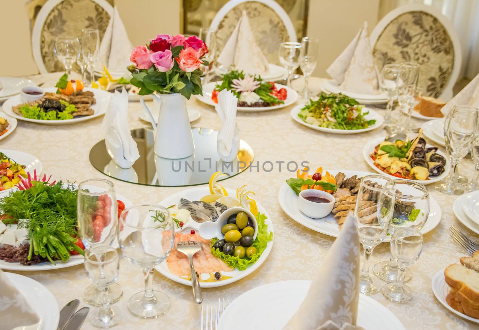 Table set for celebration in classic style with meal in restaurant