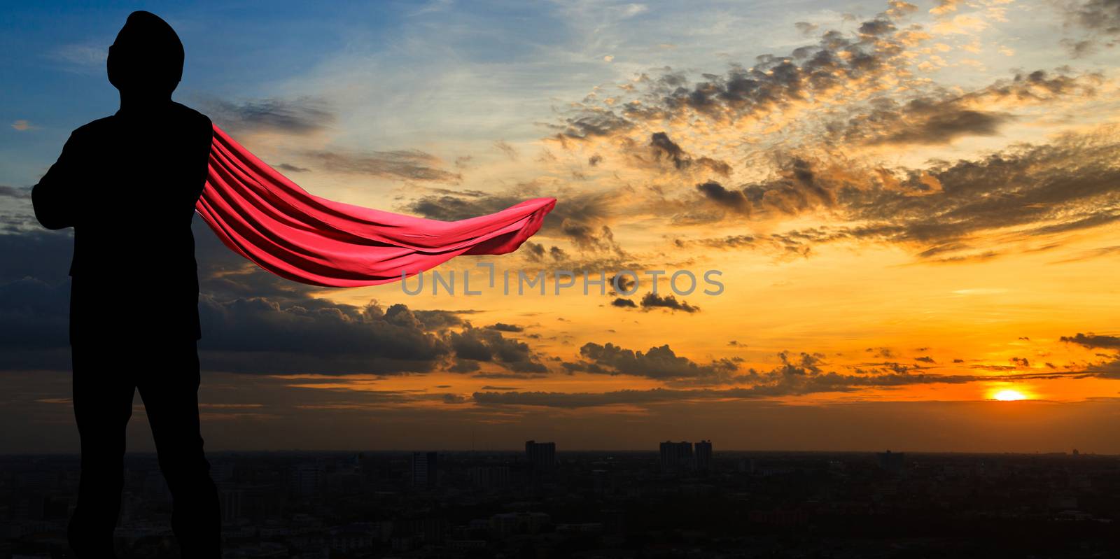 Silhouette of Super businessman at twilight in the city