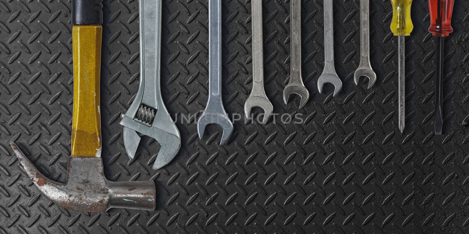 Set of hand tools on metal background