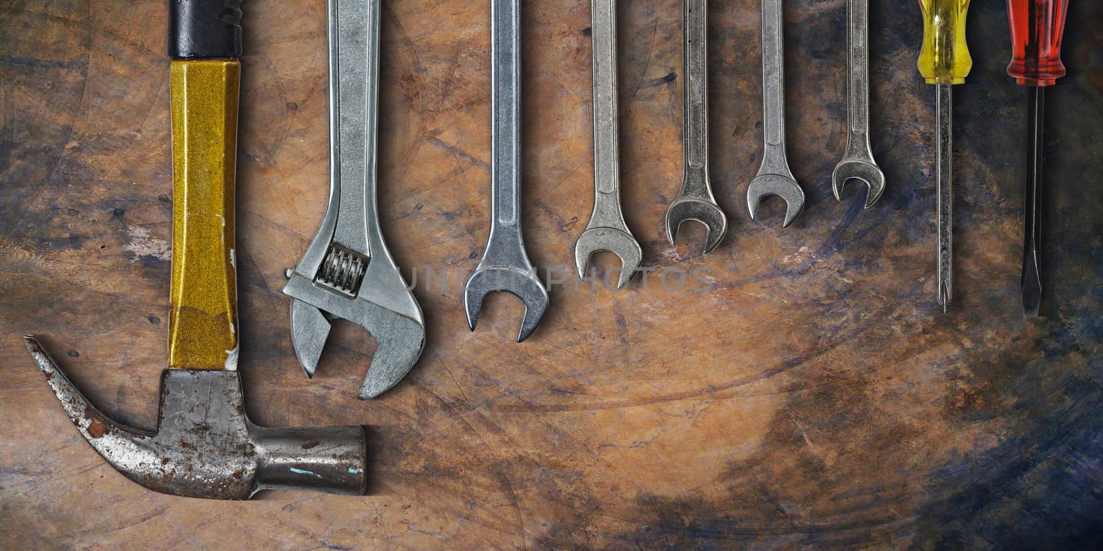 Set of hand tools on old cement background