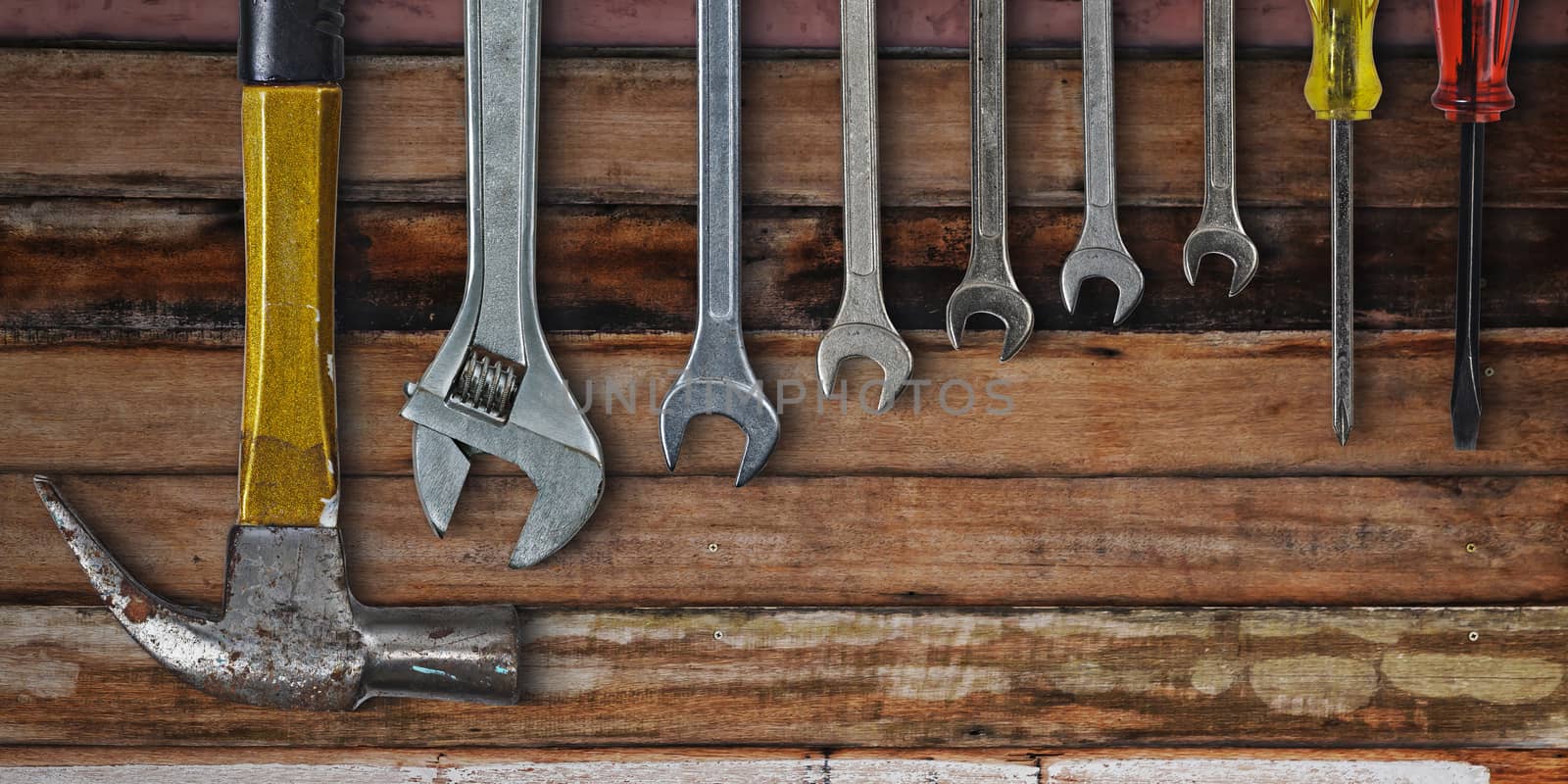 Set of hand tools on old wooden background