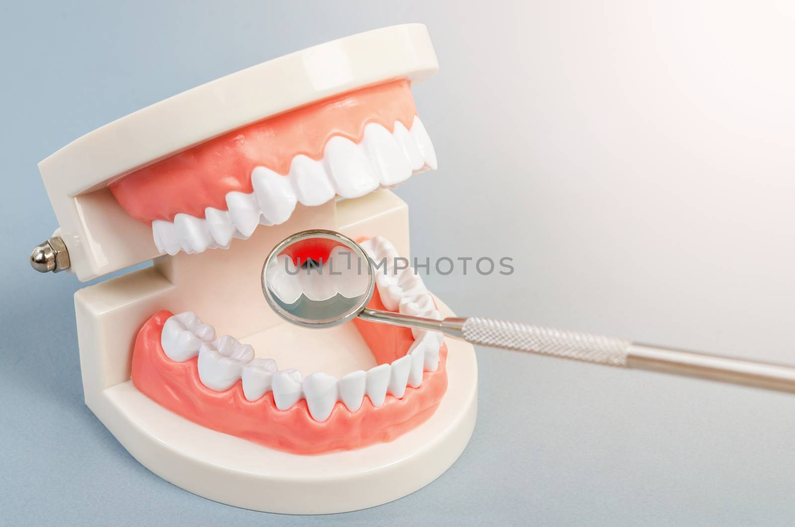 Tooth dental caries on denture with equipment dental. Dental concept.