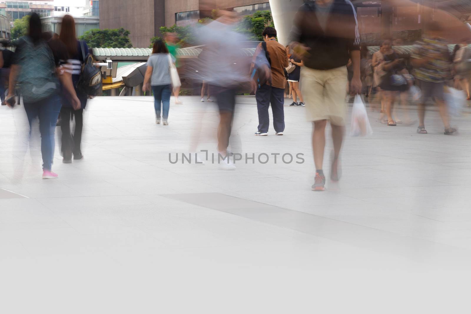 People walking in motion blur in the city