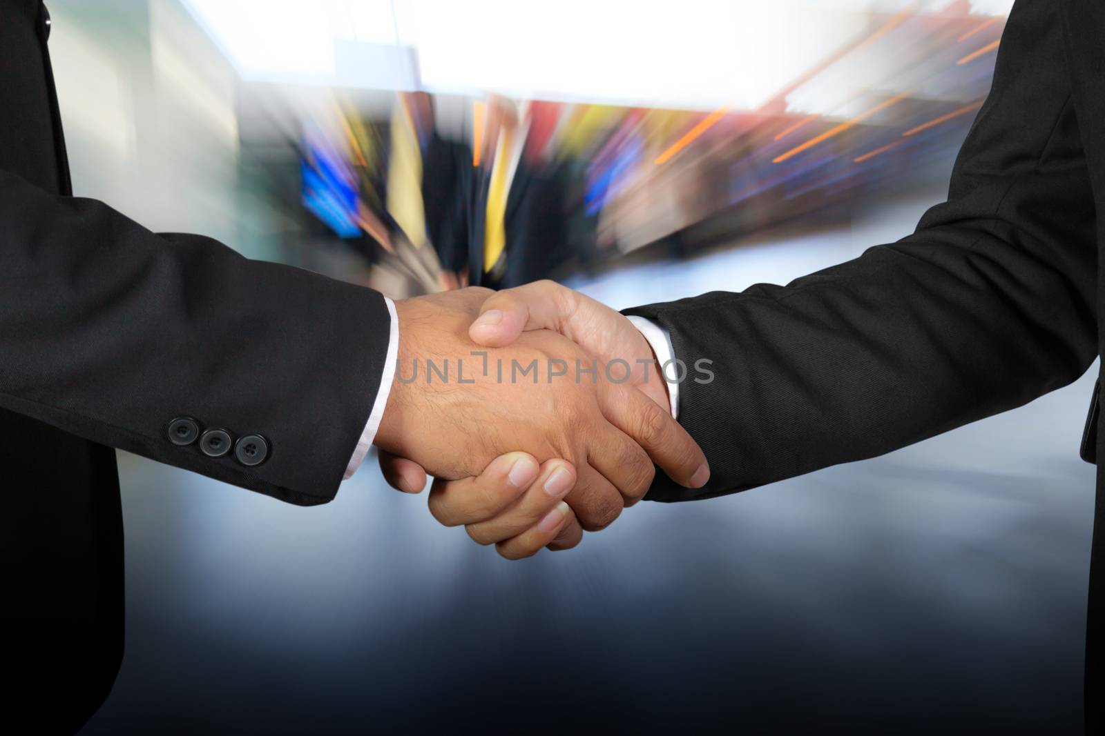 Businessman handshake, Successful businessmen handshaking in a modern office blurred background