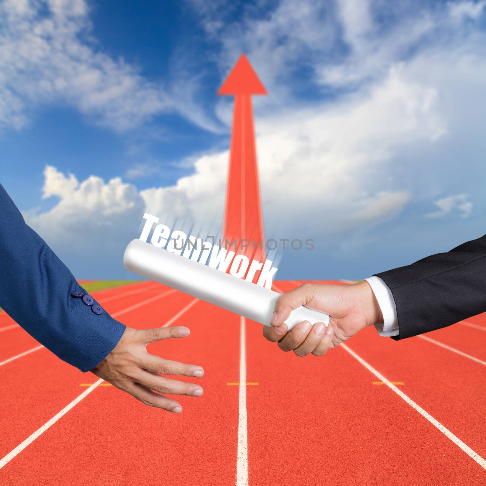 Cropped hand of businessman passing relay baton to colleague, the concept of teamwork for business success on running track