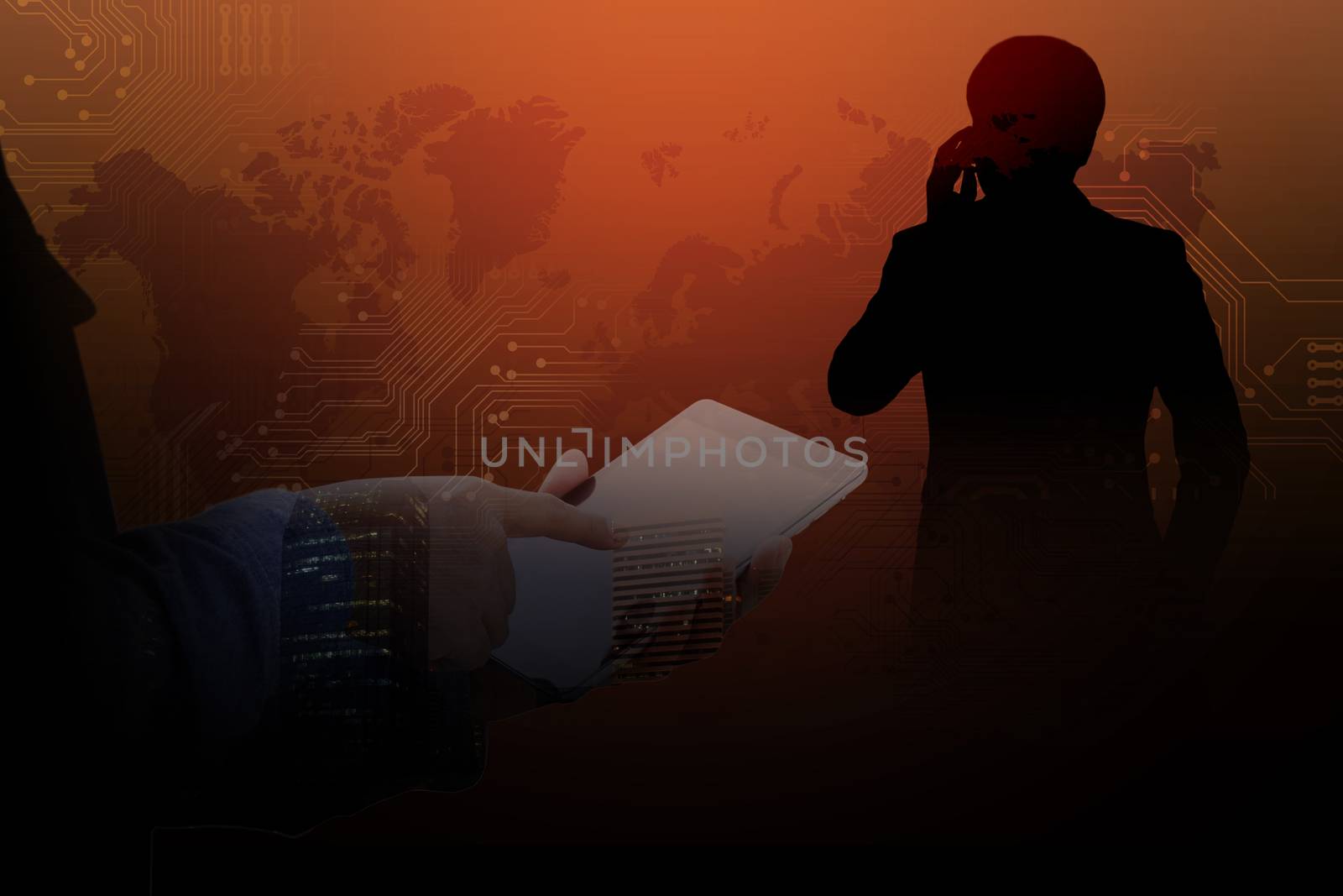 Double exposure of Technology concept, Successful Businessman using a cell phone and a digital tablet in a Abstract Technology Backgrounds