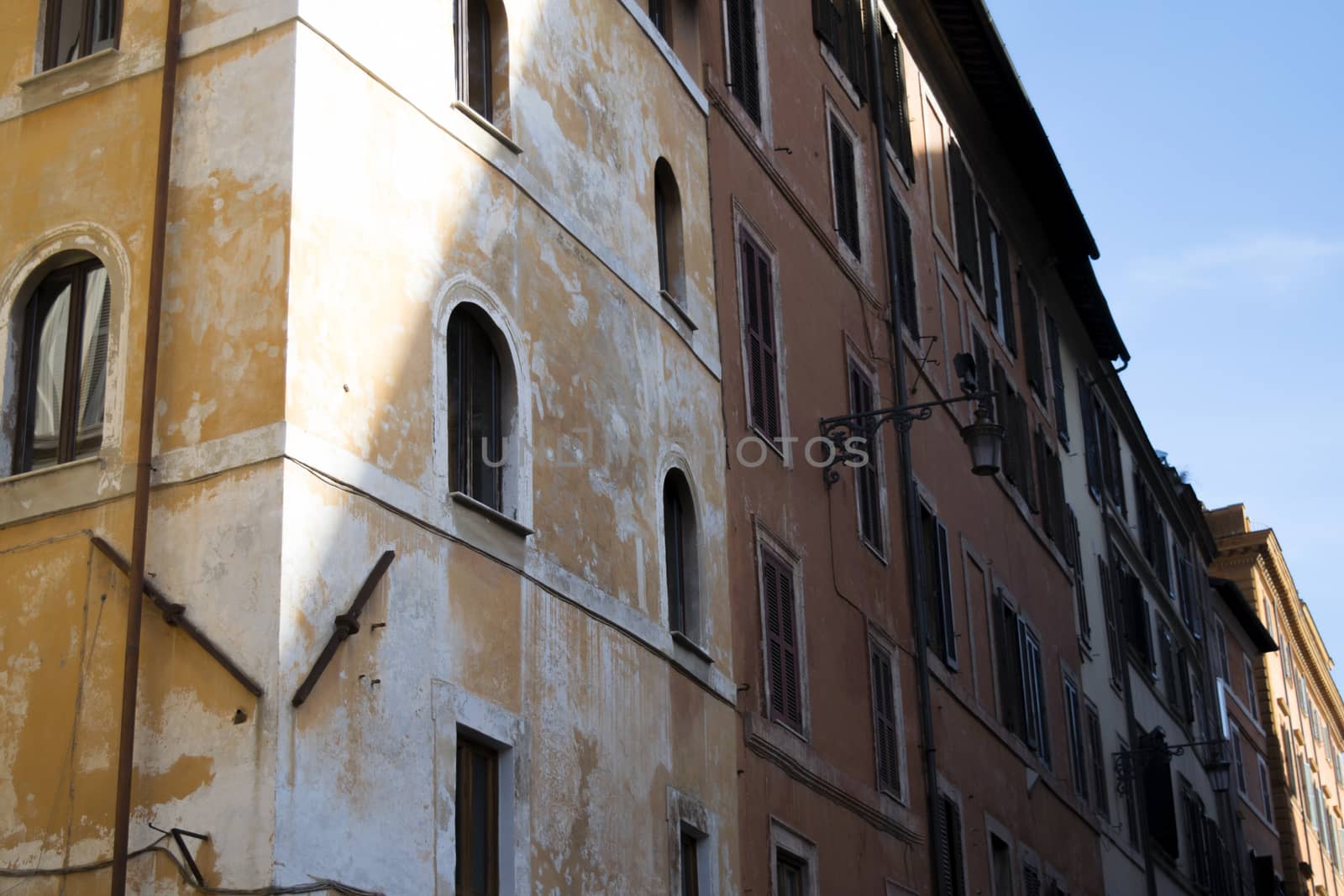 old buildings in Rome with contrast between lights and shadows