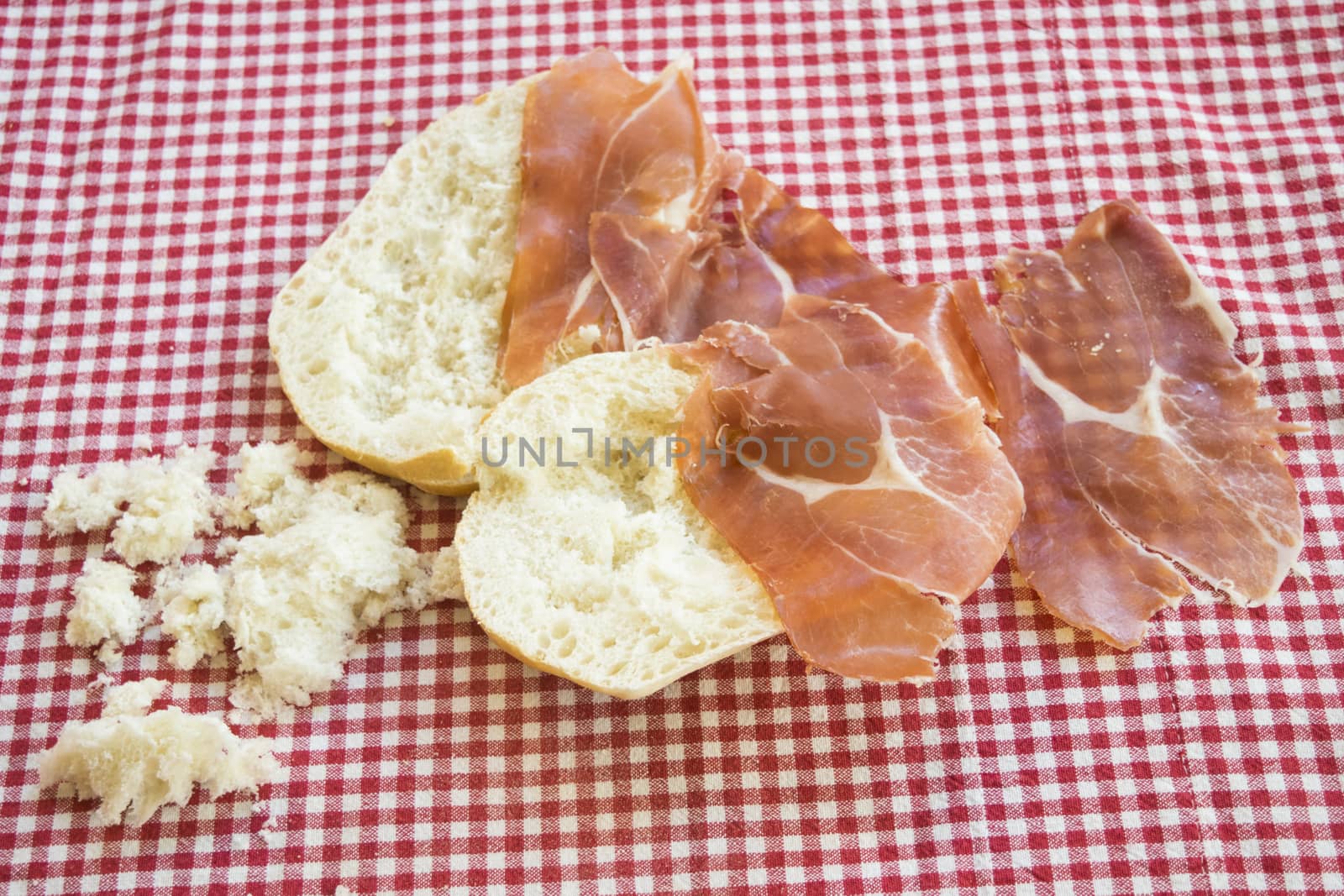 making smoked ham sandwich using a bread roll called rosetta