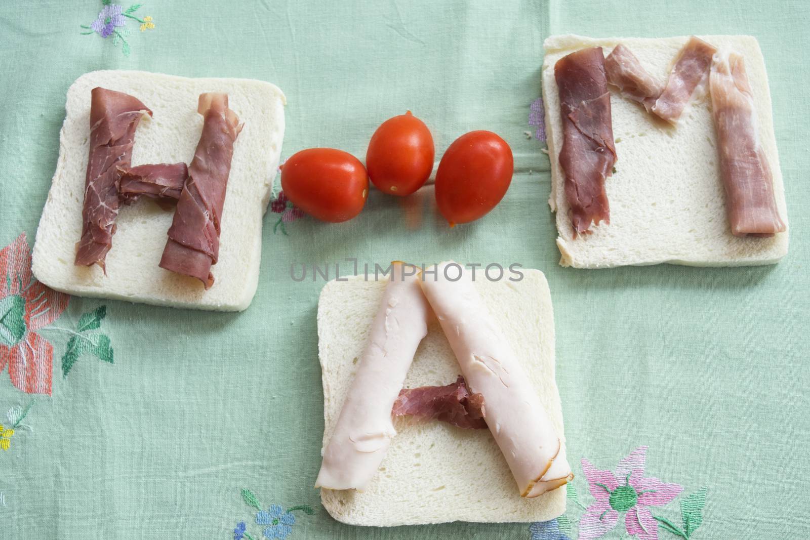 writing ham made with slices of mixed ham on slices of sandwich breads
