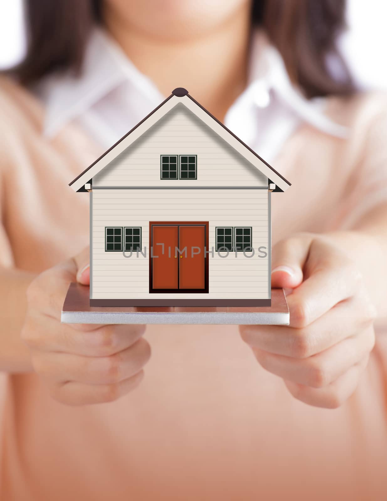 Woman holding little house