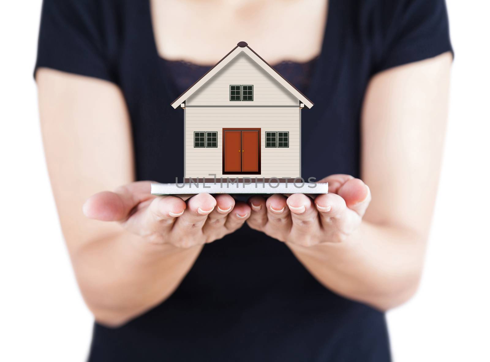 Woman hands holding little house