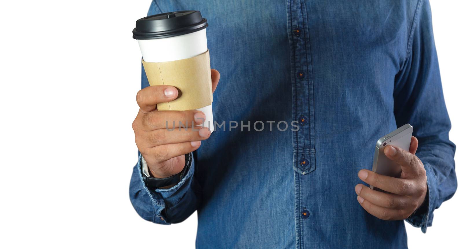 A young man holding a coffee in a coffee shop with phone
