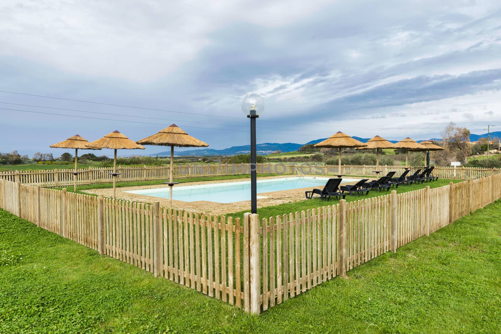 swimming pool with mountains as background