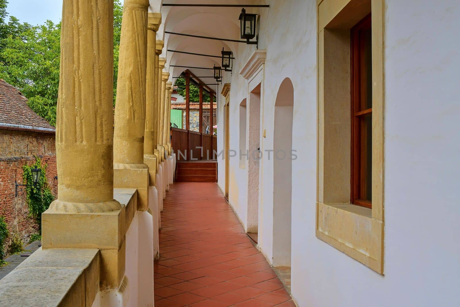 View on romantic urban scenery. Historic urban backyard. Renaissance house with arcades, loggias. Close-up.