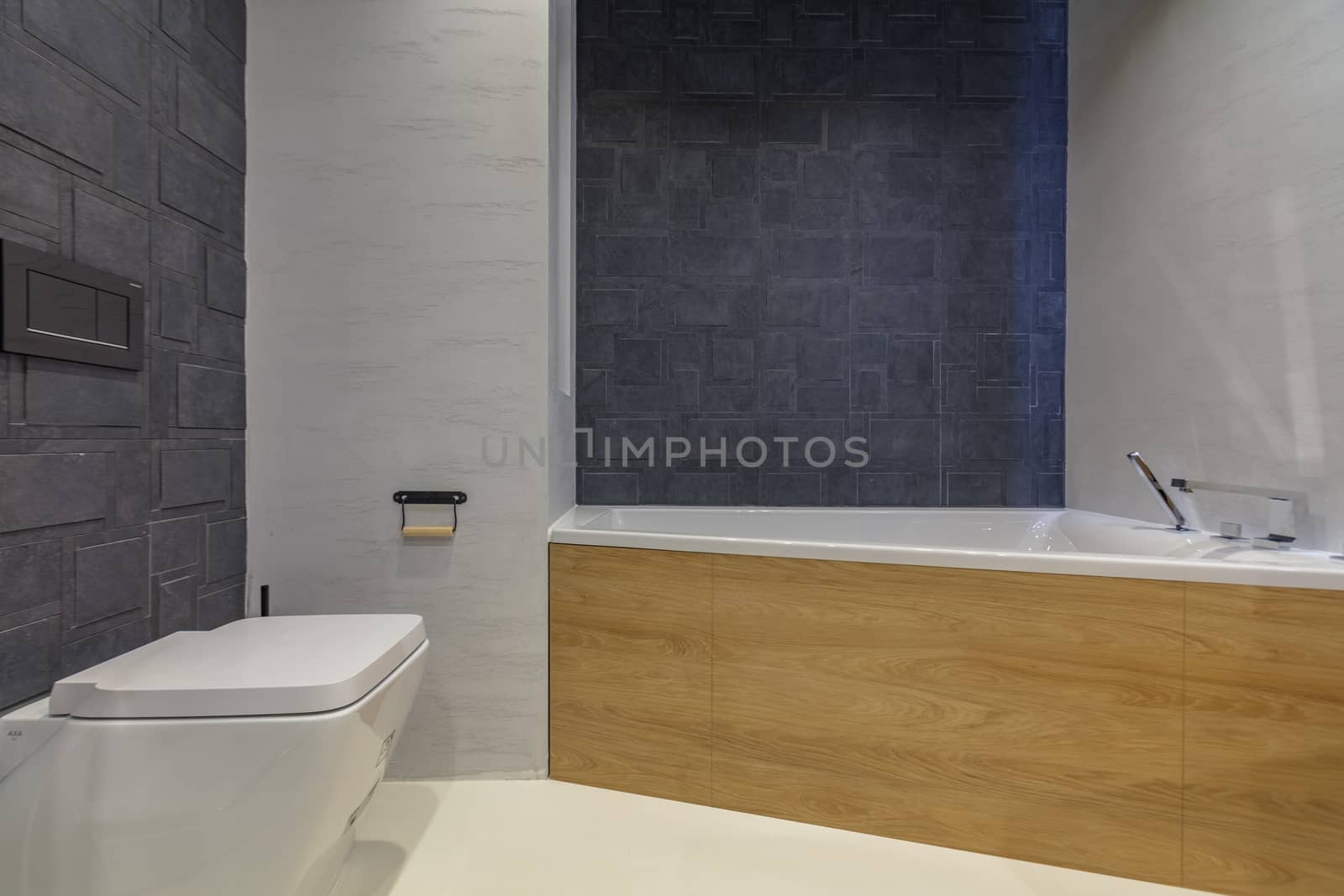 Modern bathroom interior with bath tube and toilet bowl