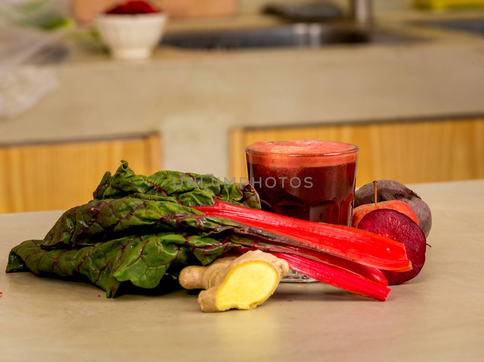 Glass jar of red juice, a detox beverage.   