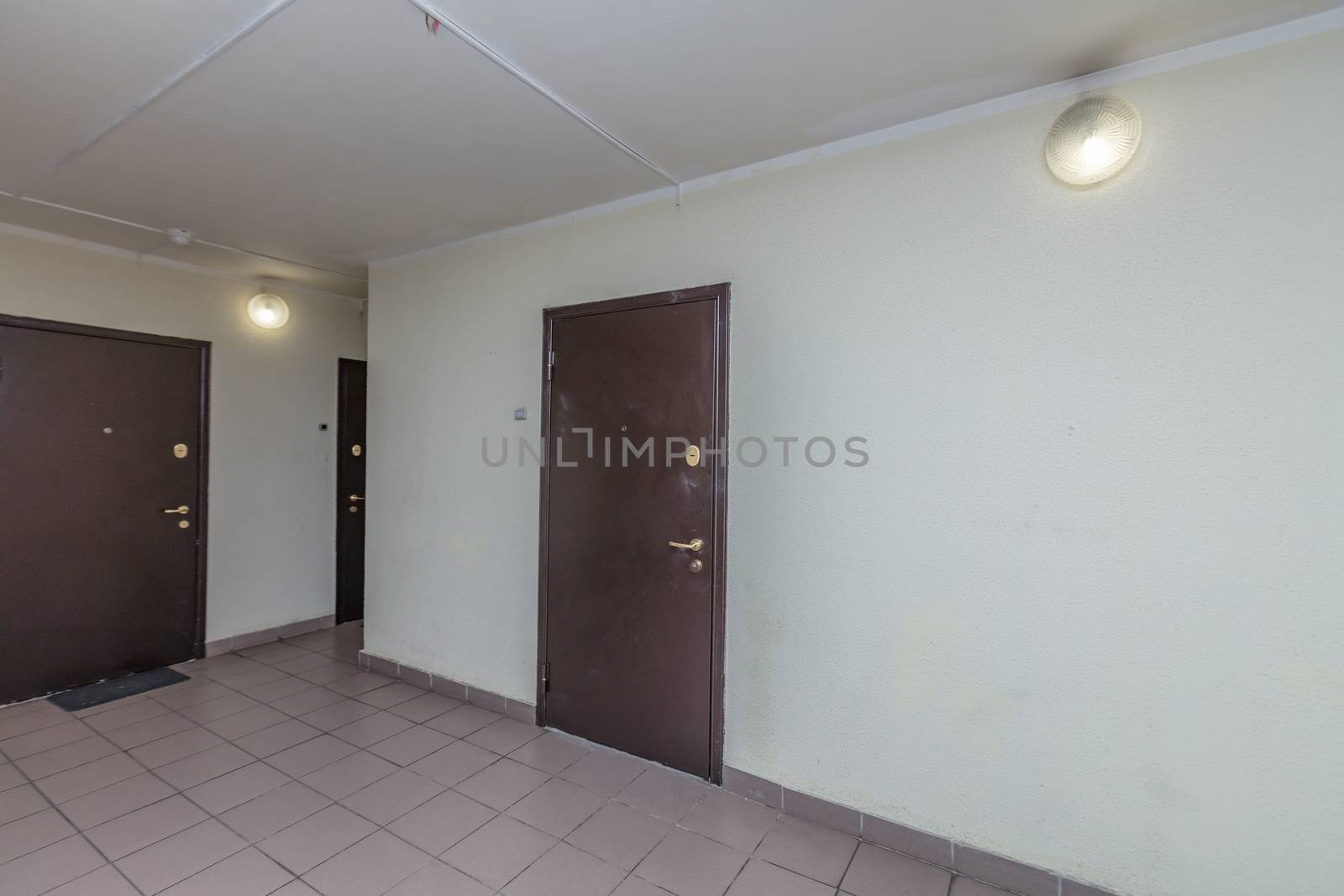 Residential building apartment doors entrance with door bell