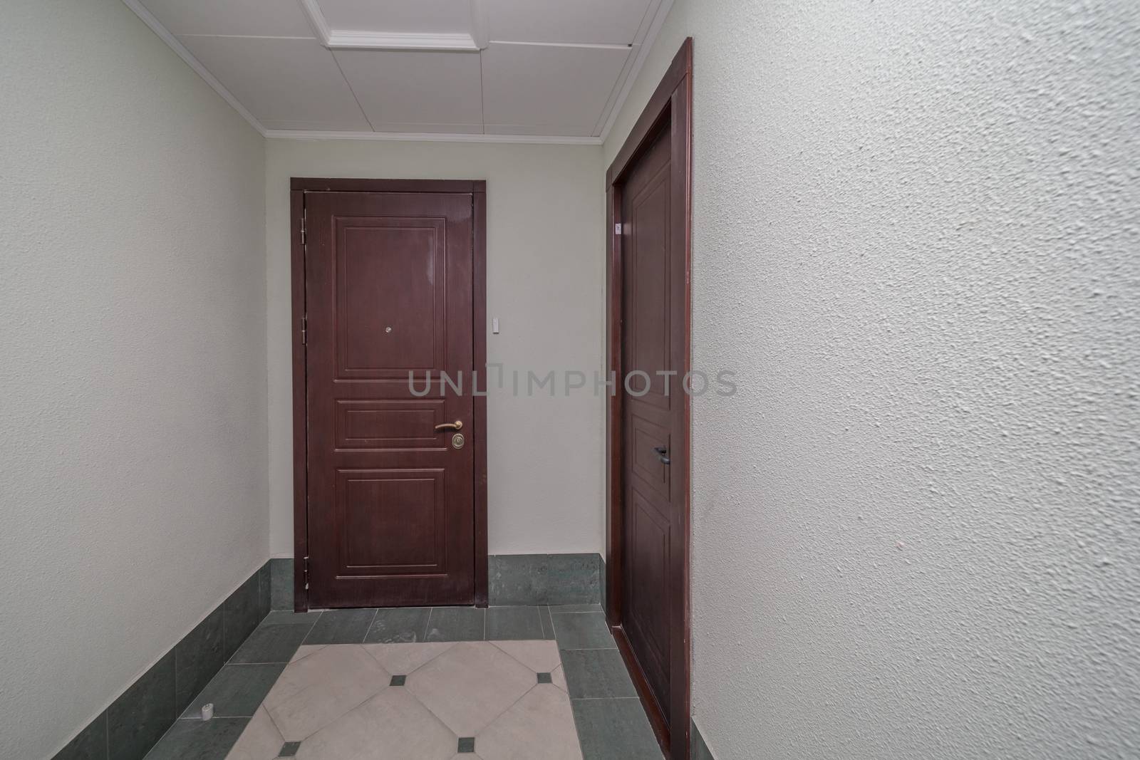 Residential building apartment doors entrance with door bell