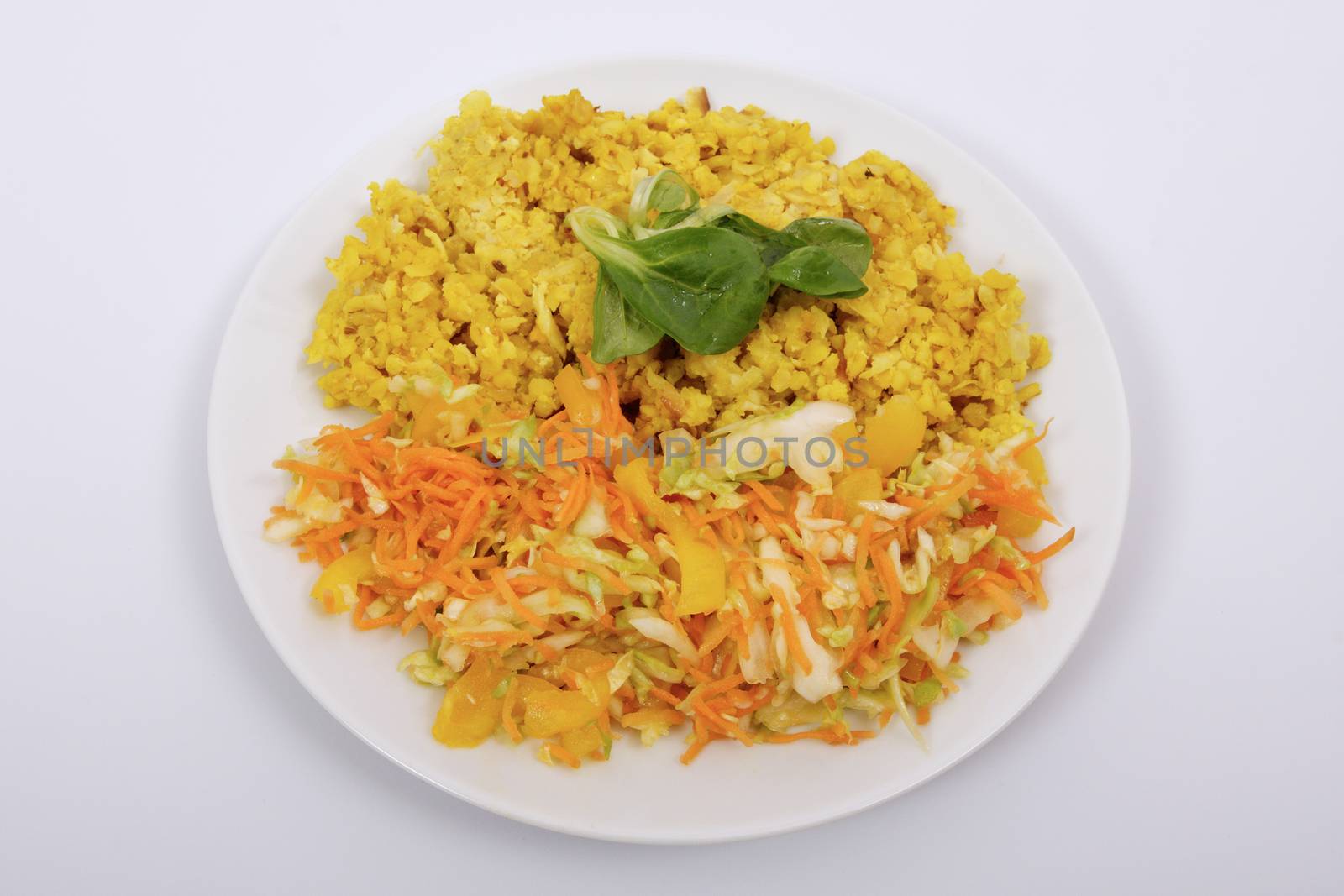 Baked Bulgar with cauliflower and vegetable salad on a white background