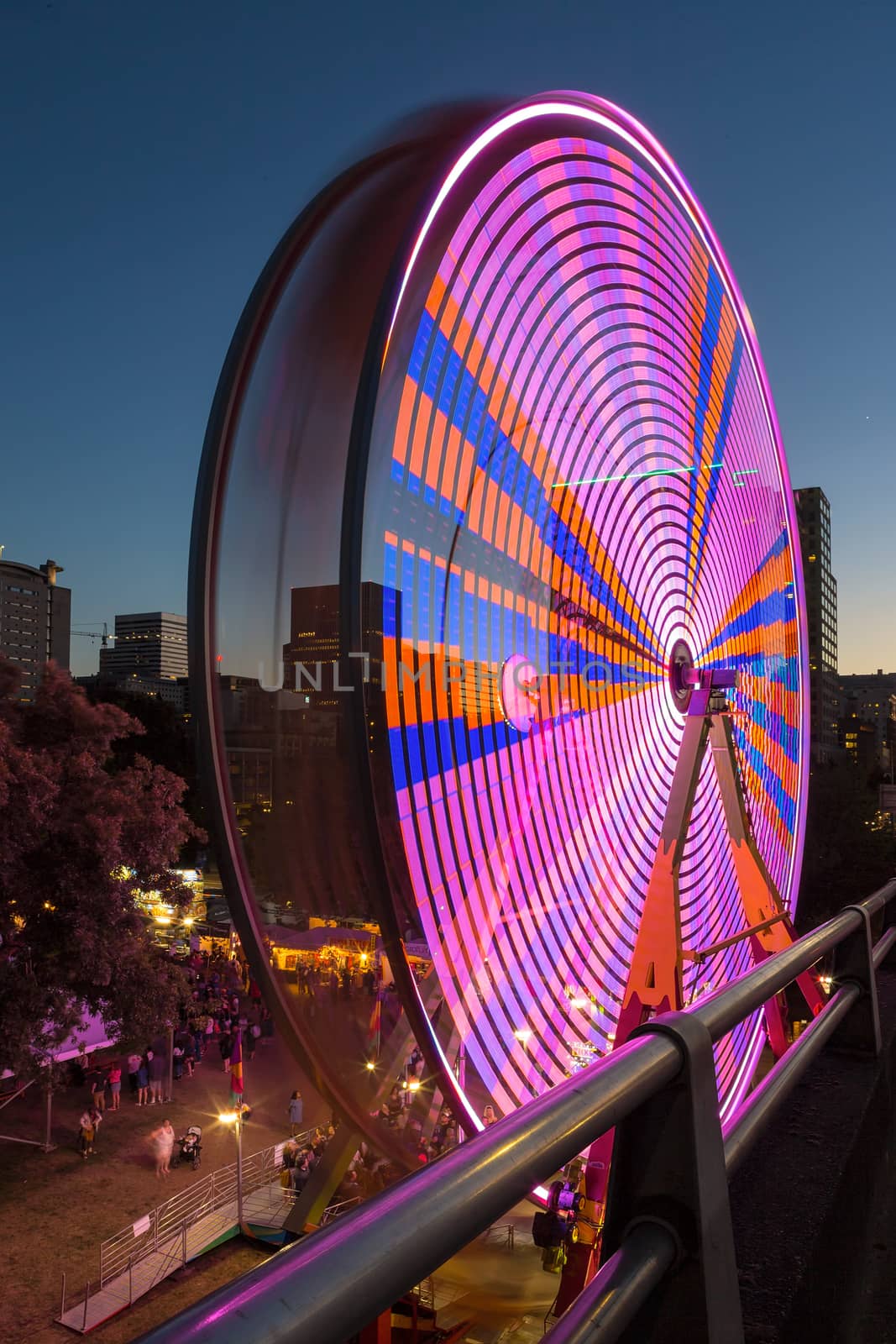 Ferris Wheel at night during Portland Rose Festival in downtown waterfront colorful lights long exposure