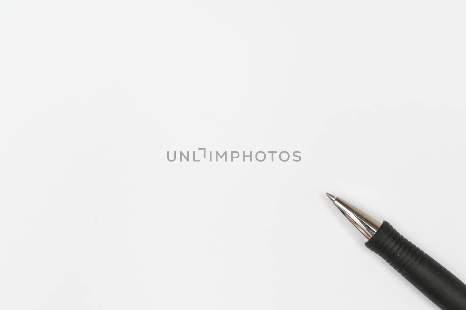 a pen on a sheet of white paper