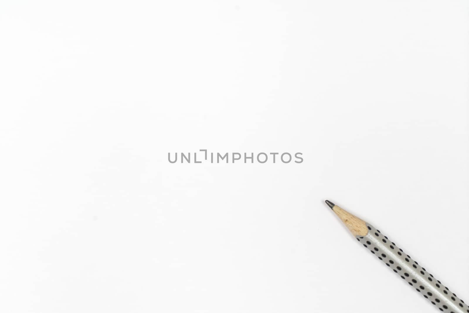 a pencil on a sheet of white paper