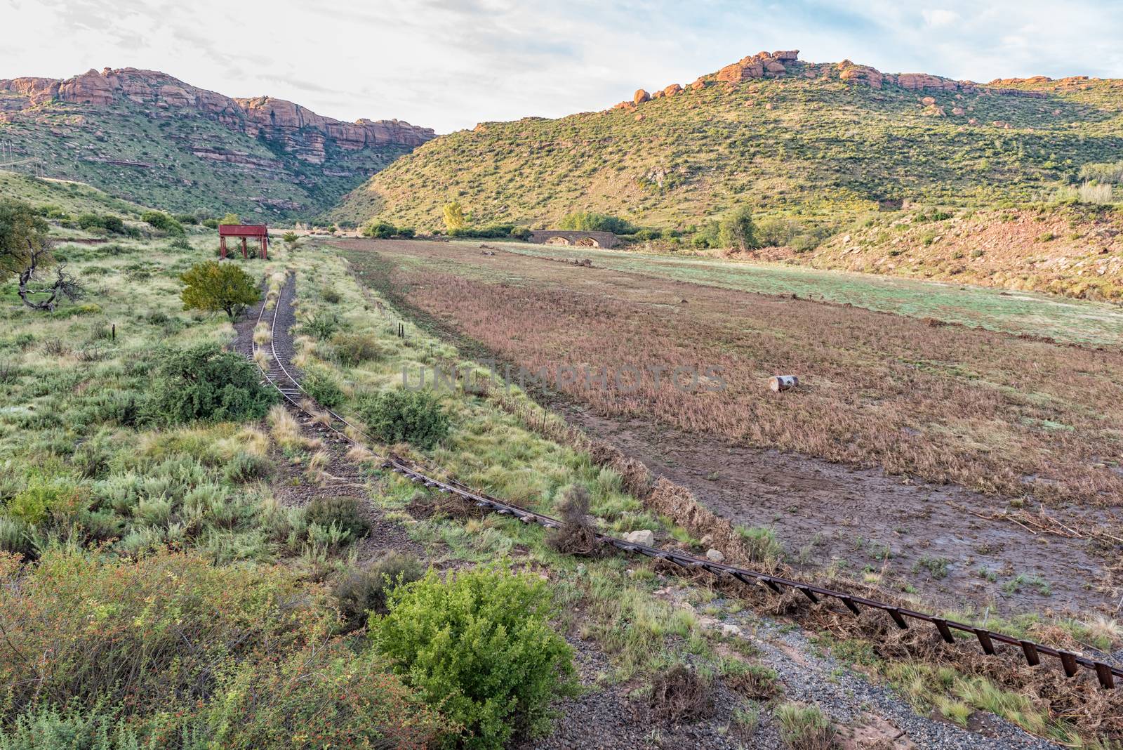The flood damaged third railway reverse near Lady Grey in the Eastern Cape Province of South Africa. The historic De Wet Bridge is visible in the back