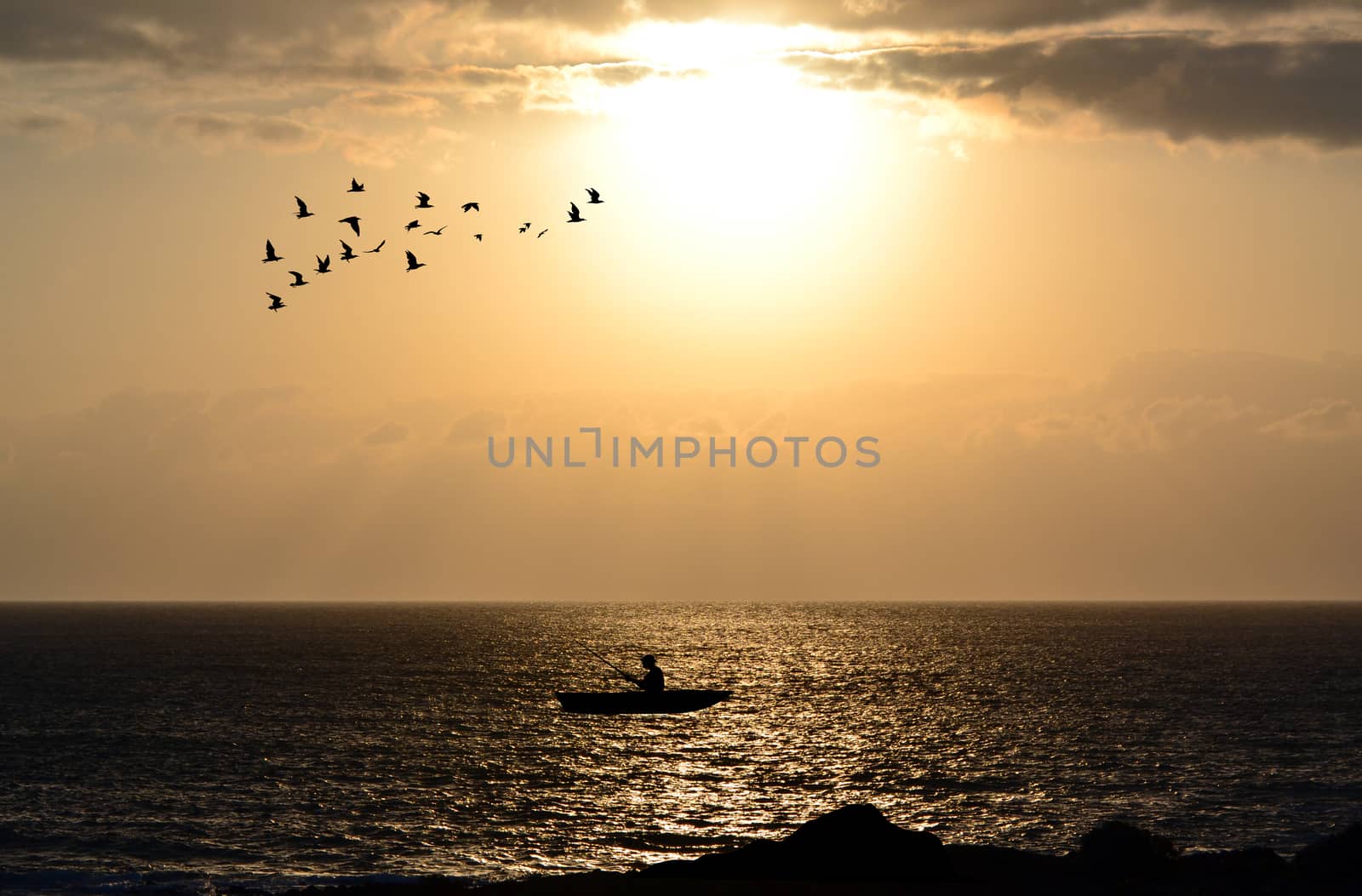 Silhouette of fishermen with his boat by hibrida13