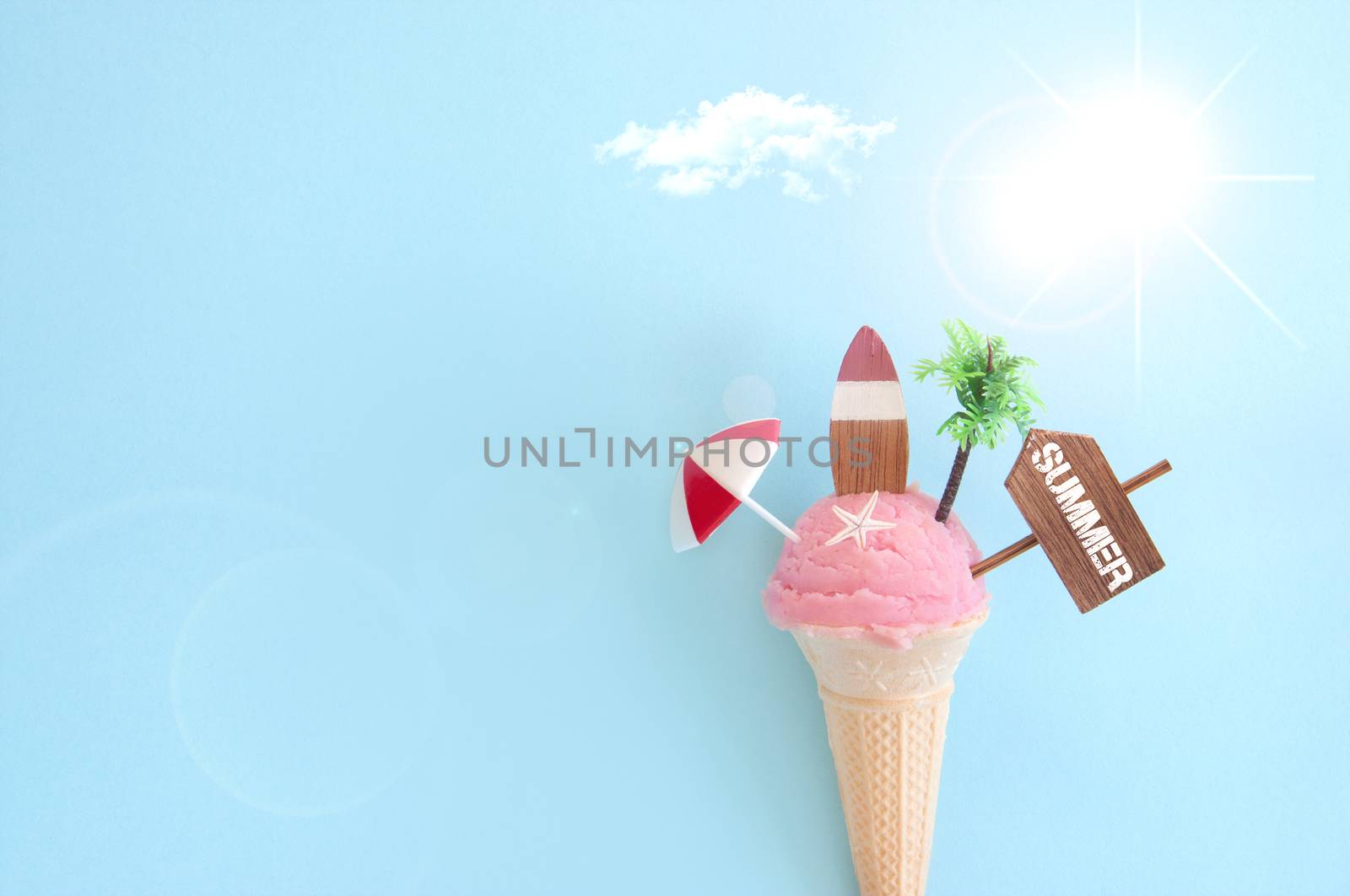Strawberry icecream with beach items and sunshine