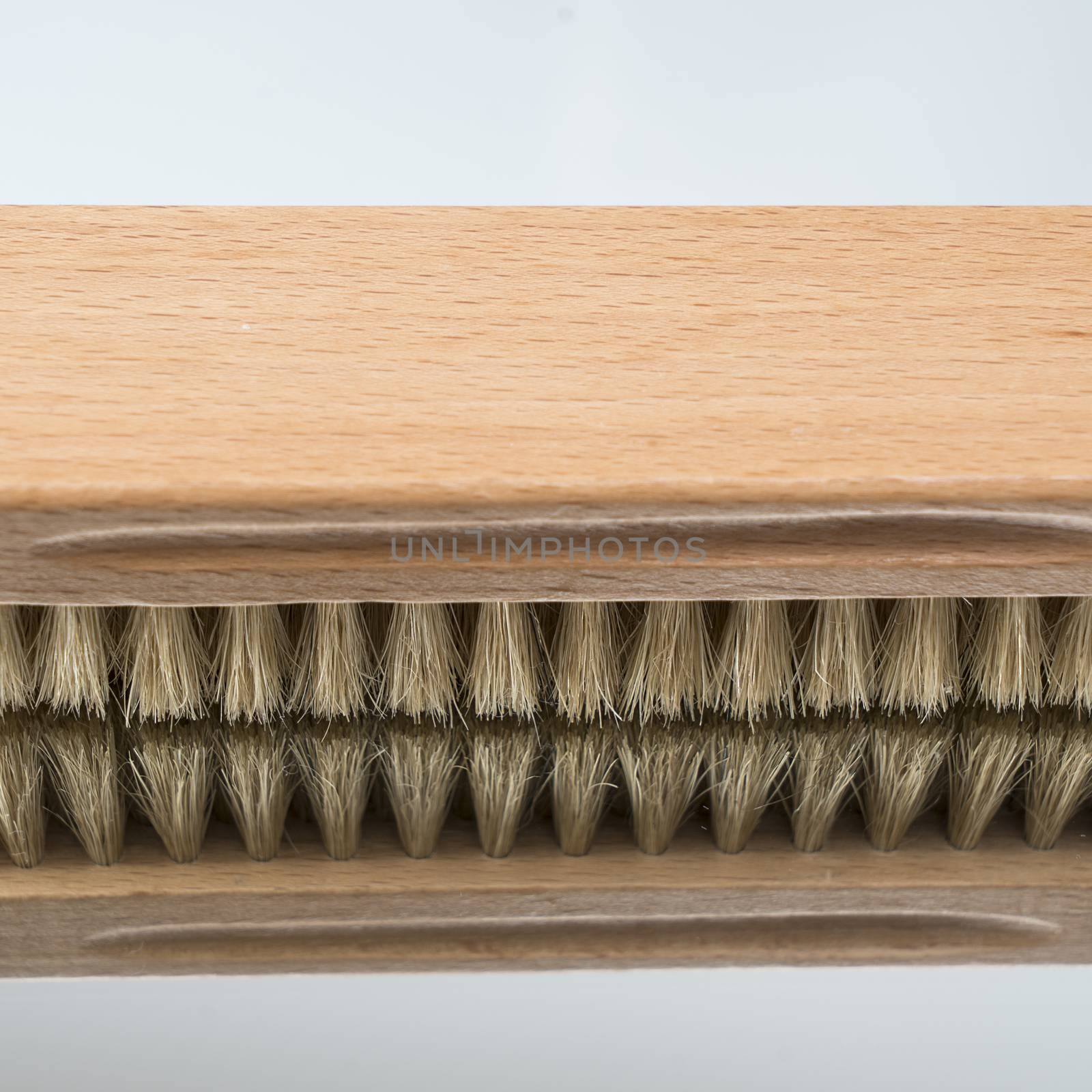 a clothes brush  on a mirror