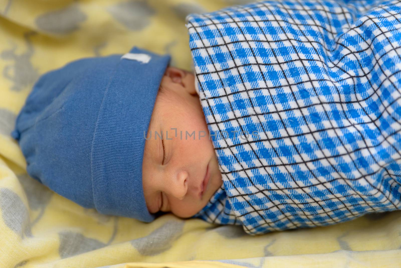 Cute Eurasian newborn baby sleeping