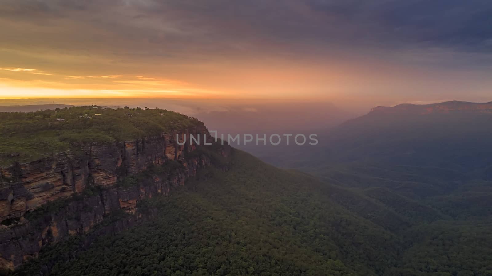 magical sunrise with cloud cover and mist filled Jamison Valley, Blue Mountains, Australia