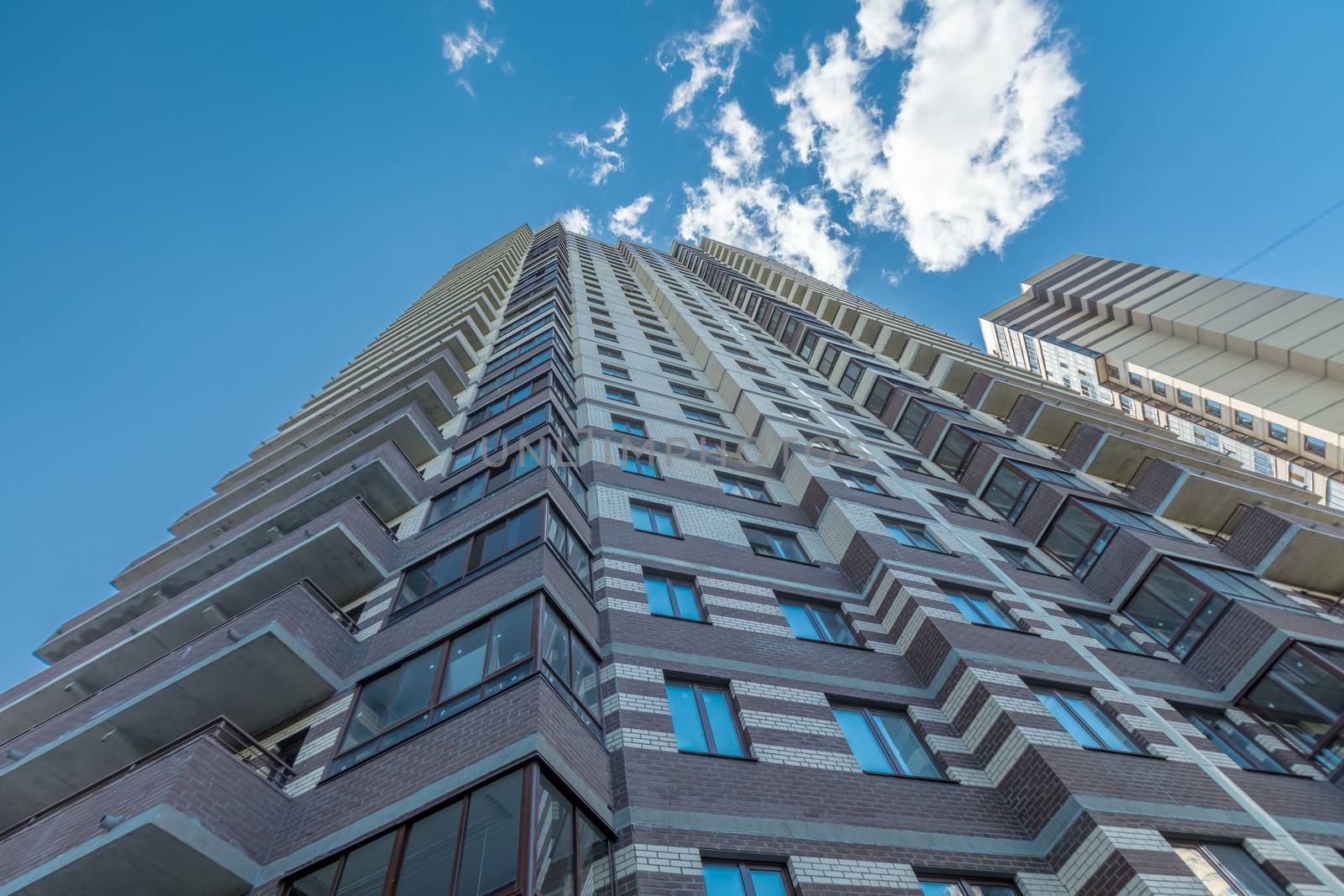 Modern building exterior low angle view with blue sky