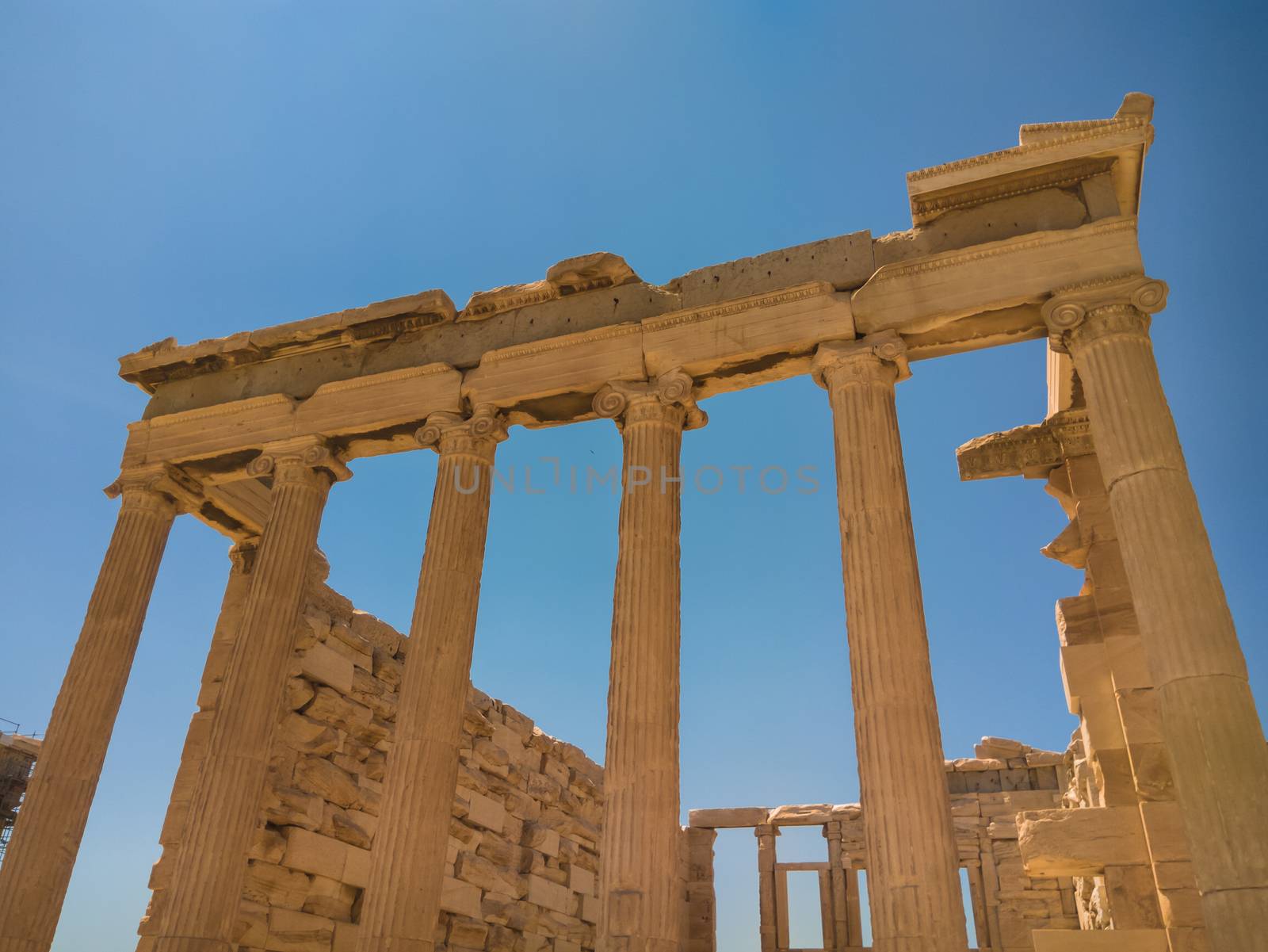 The building is on the north side of the Acropolis of Athens in Greece which was dedicated to both Athena and Poseidon