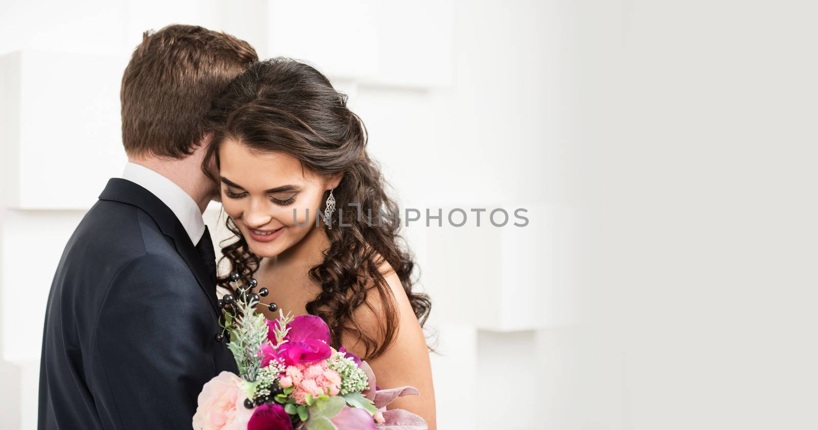 Bride and groom with bridal bouquet ready for wedding