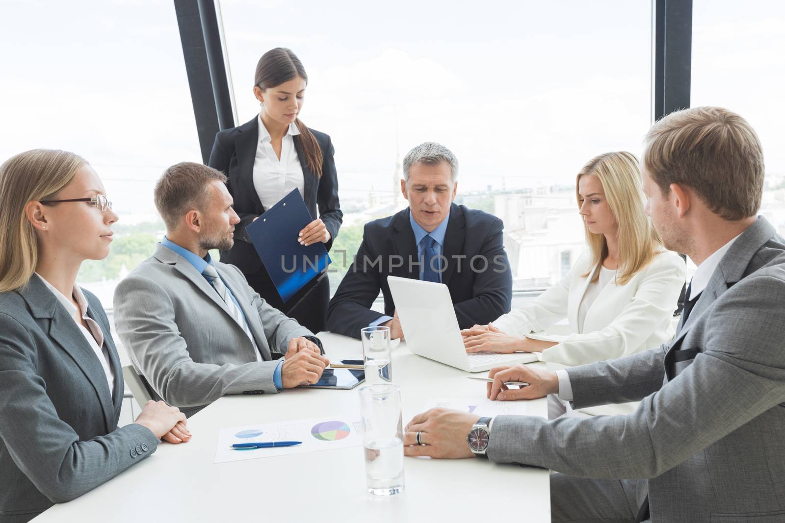 Business people team at meeting working documents together in office