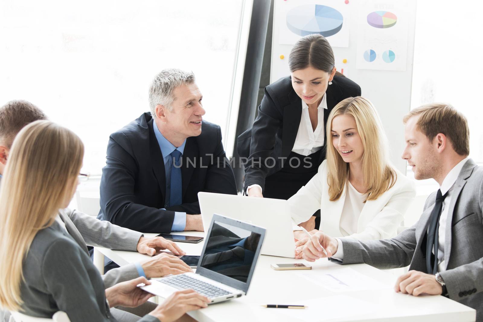 Business people work with laptop and financial statistics in office