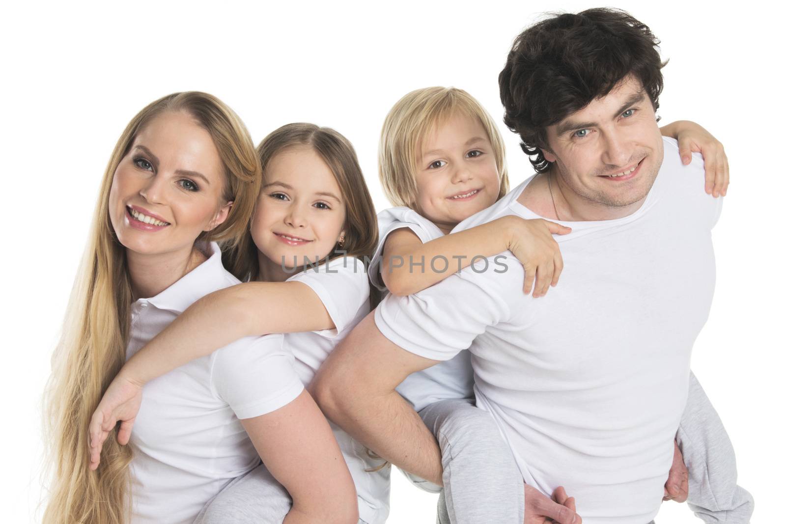 Parents giving two children piggyback rides smiling isolated on white background