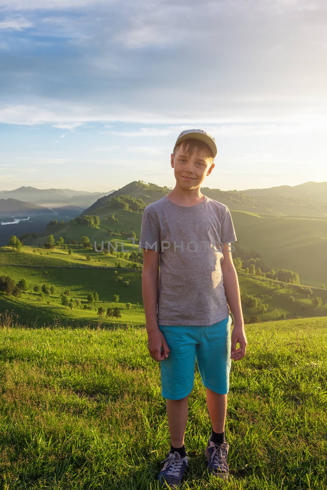 Young explorer at the sunset in Altai mountains