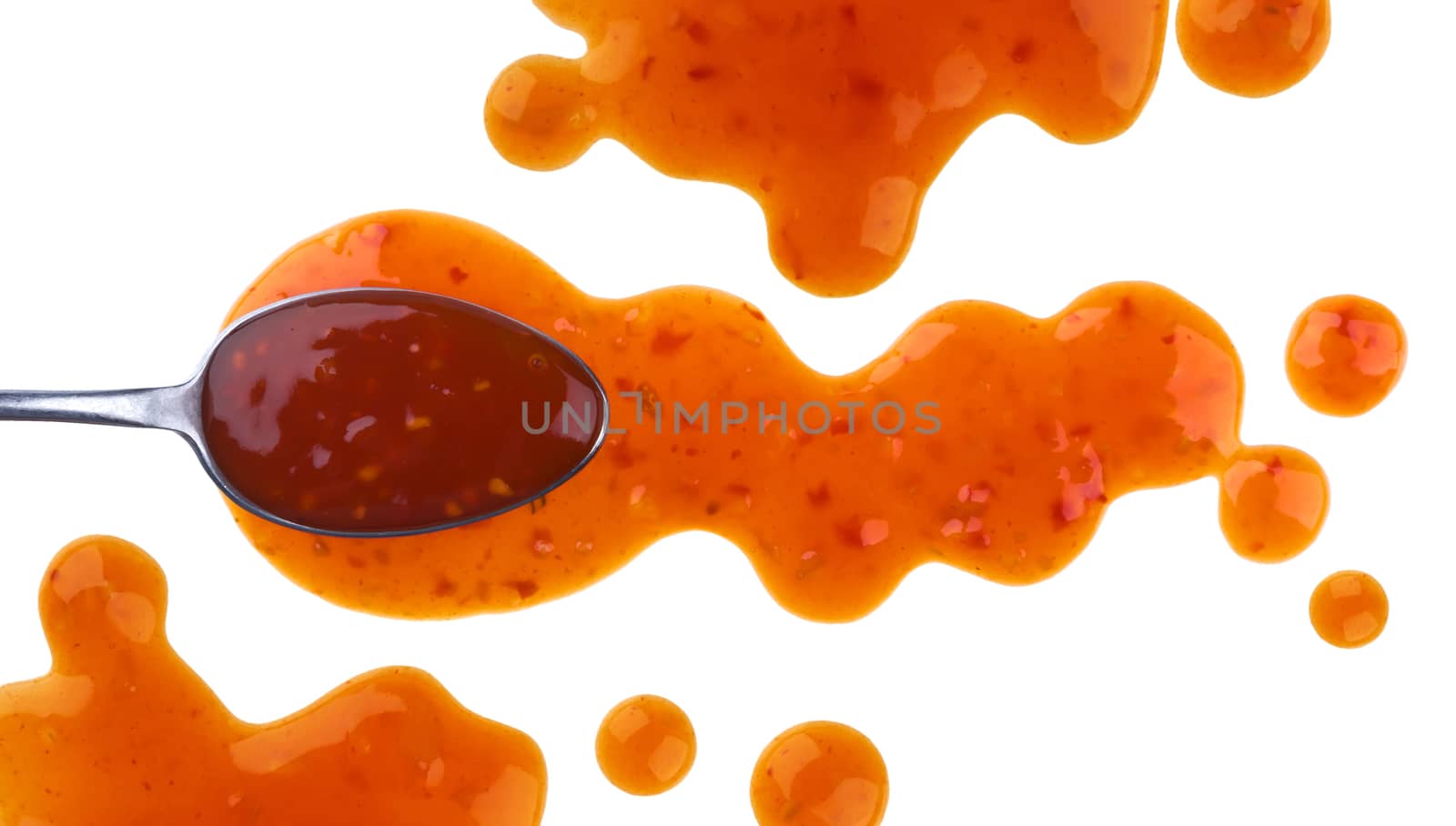 Splach of sweet and sour sauce with spoon isolated on white background. Top view by xamtiw